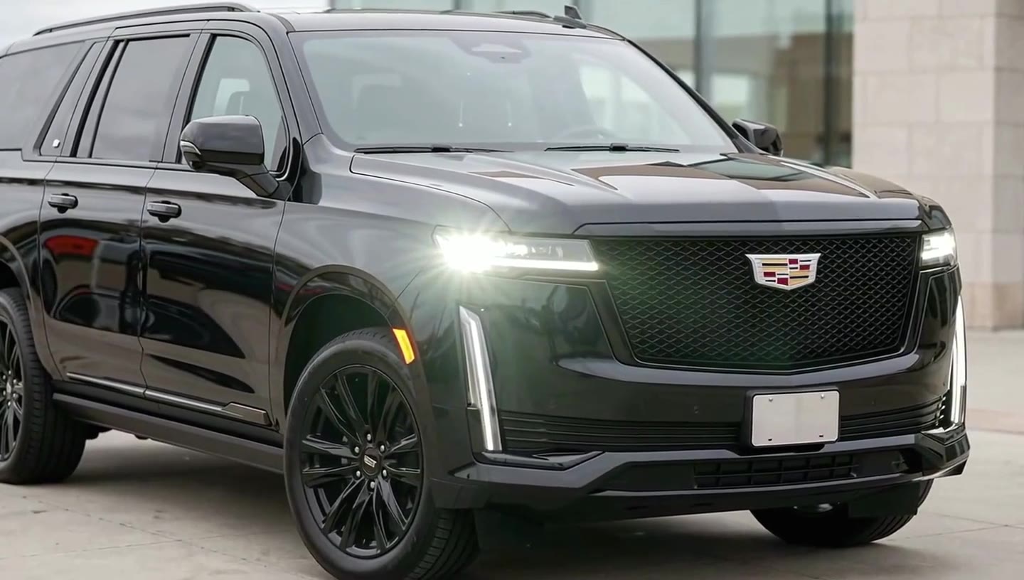 Poster frame of the Sterling Motorcars commercial: a Cadillac Escalade ESV under a light sweep